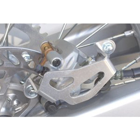 WORKS CONNECTION REAR BRAKE CALIPER GUARD KAWASAKI/SUZUKI KX250F 04 - 25, KX250XC 20 - 25, KX450F 06 - 25, KX450XC 20 - 23, RMZ250 04 - 06 - ACE Race Shop